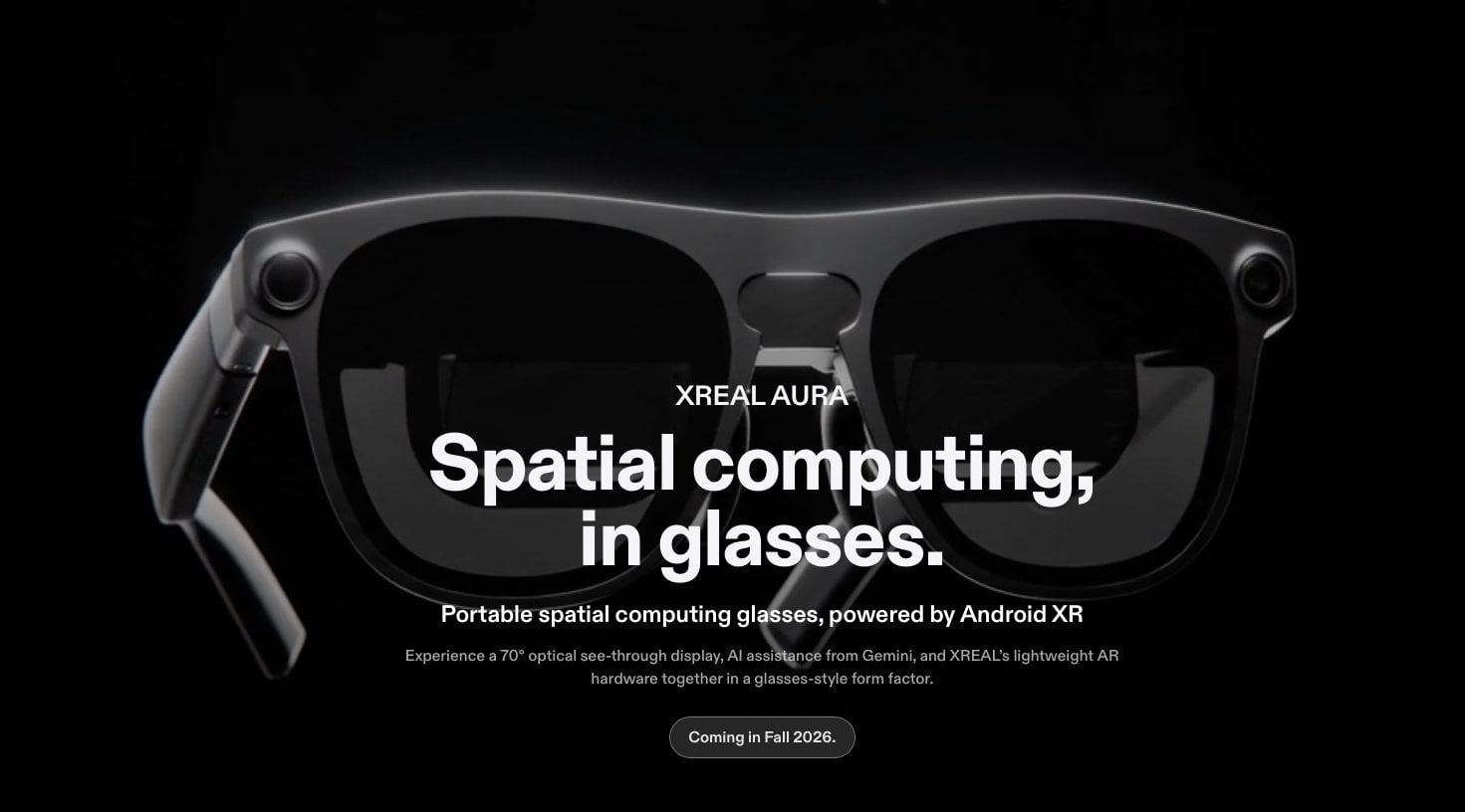 A person wearing the XREAL Aura smart glasses prototype.