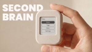 The completed minimalist AI note device resting on a desk.