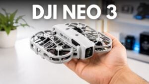 A person launching a small autonomous drone from the palm of their hand