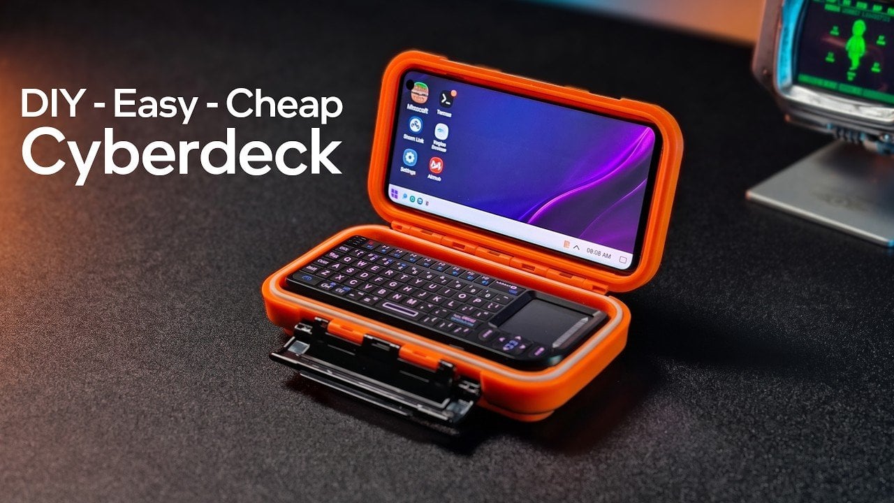 A Galaxy S10 smartphone mounted inside a modified tackle box cyberdeck.