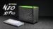 The GMKtec NEO X1 Pro sitting on a desk highlighting its gray and green color scheme.