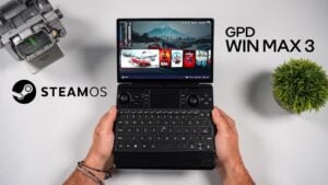 The GPD Win Max 3 mini laptop sitting open on a desk.