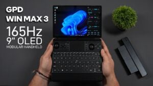 The GPD Win Max 3 handheld gaming PC sitting open on a desk.