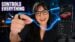 A person using hand gestures to control a screen with the KiWear ring