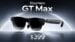 Front view of the RayNeo GT Max AR glasses resting on a desk.