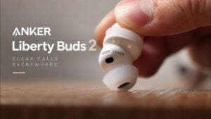 Anker Soundcore Liberty Buds 2 resting next to their charging case
