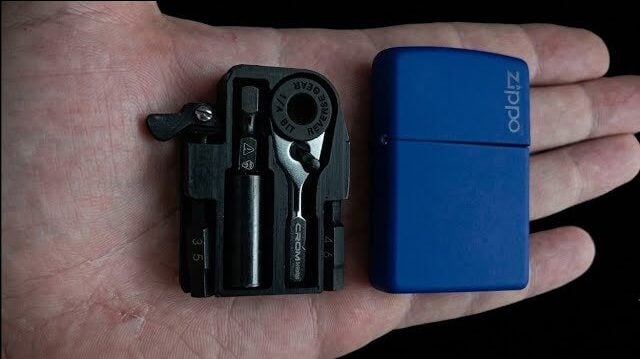 Open Zippo case revealing a custom micro toolkit inside