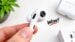 Concept rendering of Apple AirPods featuring built-in camera lenses.