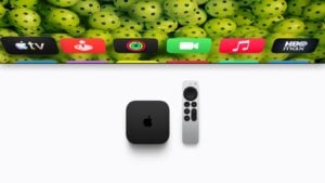 A user interacting with the new Apple TV using voice commands