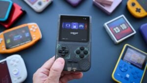 Several budget retro handheld consoles displayed side by side.
