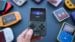 Several budget retro handheld consoles displayed side by side.