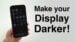 An iPhone in a dark room with a heavily dimmed display.