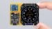 Fully assembled ESP32 digital compass showing the heading on a round screen.