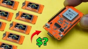 Close-up of an ESP32 development board with a built-in TFT screen.