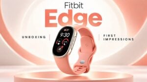 The Fitbit Edge fitness tracker and its packaging resting on a desk.