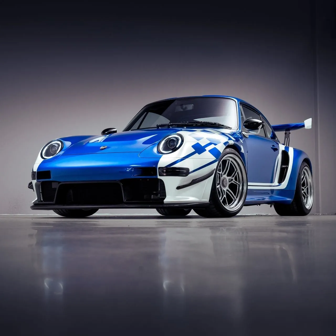 Exterior profile of the sports car showing the two-tone pearl livery inspired by Martin Brundle's crash helmet.