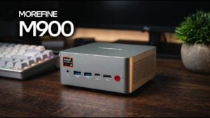 Front and side view of the compact Morefine M900 mini PC on a desk.