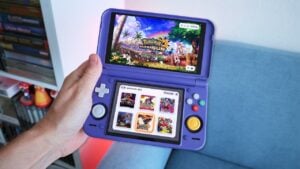 The Retroid Pocket Duo clamshell gaming handheld opened up showing its dual screens.