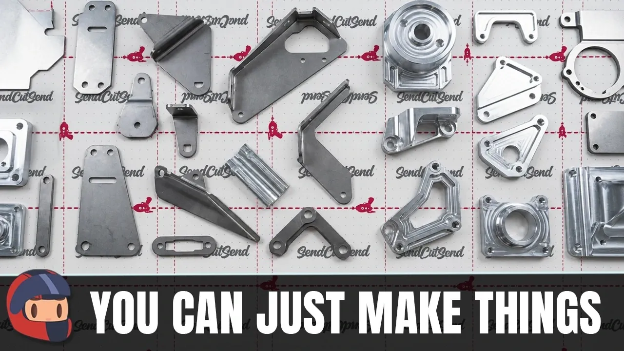 An assortment of small-batch custom fabricated metal parts resting on a workbench.