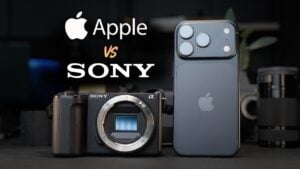 A side-by-side physical size comparison of a smartphone and a mirrorless camera.